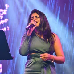 Lost in the song during a live performance. These moments on stage, under the lights, are what I live for.