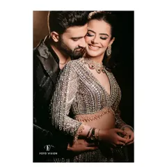 A tender embrace captured with a focus on the bride's joyful expression, showcasing the warmth and love between the couple during their celebration.