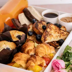 My 'Breakkie In Bed' box is one of my favorite creations for Mother's Day. It’s filled with fresh croissants, muffins, French toast, and orange juice, because every mom deserves a beautiful start to her special day.