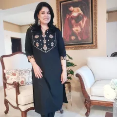 This comfortable black kurta set is a go-to for me. The heavy embroidery on the neckline means it doesn't need a necklace, showing how the outfit itself can be the main focus. I guide my clients on how to accessorize smartly to complement, not overpower, their clothes.