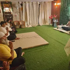 A glimpse into an in-person group meditation session at my Aura Yog Centre. Here, a community of seekers gathers to connect, heal, and support one another on their spiritual path, guided by me through the process of ancestral connection.