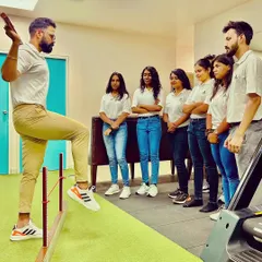 As a leader, I believe in empowering my team. Here I am teaching my colleagues about advanced physiotherapy principles to ensure we all continue to grow and provide the best care.