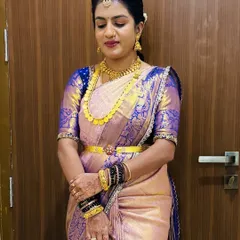 A beautiful client in a lavender and blue silk saree. The makeup is soft and enhances her features, paired with traditional gold jewellery.