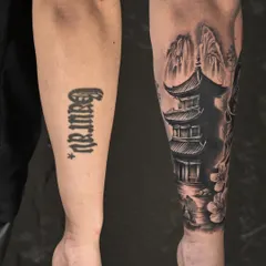 This is one of our favorite types of transformations. A simple name tattoo on the forearm is expertly covered by a detailed Japanese pagoda scene, giving the client a completely new and beautiful piece of art.