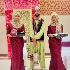 Our staff dressed in themed attire, including traditional Kashmiri outfits, to match the specific requirements and theme of a client's event.