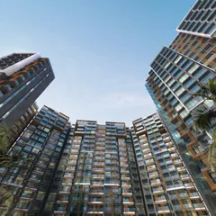 A dramatic ground-up view of Radius Avenue 54 in Mumbai, showcasing the grand scale of this luxury enclave. The design's curved facade and towering presence are meticulously planned to create a landmark of modern elegance.