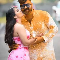 A heartwarming moment between a brother and sister during a haldi ceremony. The sister's affectionate kiss shows the beautiful family bonds that are such an important part of any wedding.