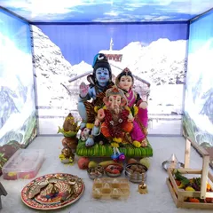 We bring your creative visions to life with unique themed decorations. This 'Mount Kailash' setup for a home Ganpati celebration transports you to the Himalayas, creating a divine atmosphere for Lord Ganesha, Shiva, and Parvati.