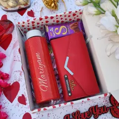A simpler but equally beautiful Valentine's combo for her. This set includes a personalized red sparkle flask, a custom 3-fold ladies clutch, and a Cadbury Silk chocolate, all in a gift box.