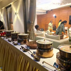 Your party's aesthetic matters. I provide a full buffet setup with these gorgeous copper chafing dishes and elegant table skirting. I make sure the presentation looks just as good as the food tastes, giving your event a premium, polished feel.