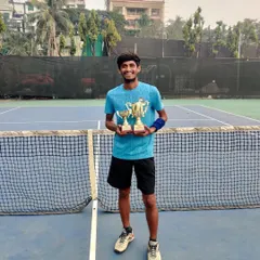 Coach Mangesh Iname with his trophies from the Coaches Tournament. His success is an inspiration to all our players at the academy.