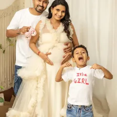 It's a girl, and the big brother's excitement is contagious. This is a perfect family announcement photo, full of energy and happiness.