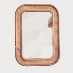 Our rectangular mirror is framed with beautifully woven cane, adding texture and warmth to the design. This piece is perfect for an entryway, bathroom, or bedroom, blending seamlessly with a variety of decor styles.