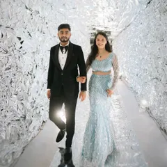 Making a futuristic statement with this incredible silver foil tunnel entrance. It was a bold and unexpected decor choice that created a memorable "wow" moment for guests arriving at the reception.
