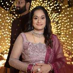 A duplicate of the solo portrait, this image highlights the intricate details of the reception gown and jewelry against the beautifully lit background.