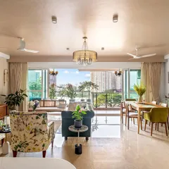 In our 'Tatvam' project, we made a bold choice to paint the ceiling a neutral blush pink. This decision filled the mid-century modern living room with a rich hue and unexpected warmth, making the entire space feel cohesive and inviting.