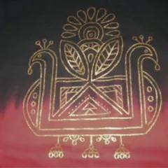 A close-up of the golden peacock motif on the T-shirt. The fine lines and traditional design are carefully painted by hand to ensure a sharp and lasting finish on the fabric.