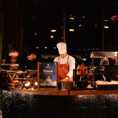 Welcome to our live Pizzeria station, where our chef crafts fresh, hot pizzas to order, bringing a taste of Italy to your celebration.