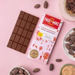 A product shot of a milk chocolate bar on a soft pink background. The colour choice complements the packaging and gives the image a gentle, sweet feel.