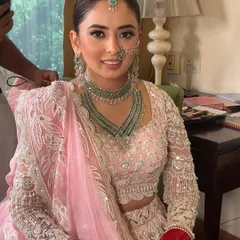 A candid moment during the getting-ready process. The skin looks luminous and healthy, which is the perfect base for a soft glam look that lasts all day.