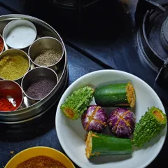 Getting ready to make Bharlela Vanga (stuffed eggplant). My masala box is always by my side, holding all the essential spices for my Kolhapuri cooking.