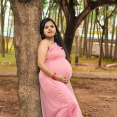 A serene solo portrait of an expectant mother in a beautiful park. The natural light and peaceful surroundings perfectly complement the beauty of this special time.