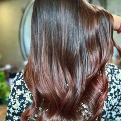 A rich copper touch balayage that adds warmth and vibrancy. This look was created with our no-bleach technique and paired with a complimentary haircut for a complete style refresh.