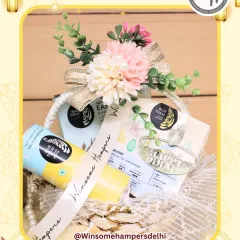 A lovely Diwali hamper featuring products from Blue Tokai Coffee Roasters. The combination of gourmet coffee and festive floral decorations makes this a sophisticated gift for the festival of lights.