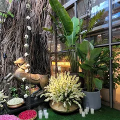 We transformed a space into a wild, magical forest for the pre-wedding bash of designers Arpita Mehta and Kunal Rawal. Here, you can see how we used the venue's incredible banyan tree as a natural centerpiece, surrounding it with tall Birds of Paradise plants and bowls of fresh flower petals to create a truly dreamy entrance.