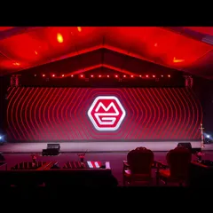 The new brand identity of MG Group glows on the main stage before the TIGRA coach reveal. We managed the show run for this rebrand event, including a split-screen mechanism for the dramatic unveiling.