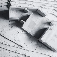 My process is rooted in craft. This physical study model shows the ground floor of a house designed for the hills, with the building's form embedded directly into the site's natural contours, demonstrating a harmonious integration of structure and landscape.