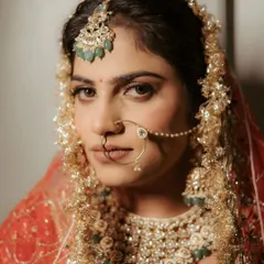 A bride's gaze holds a universe of stories. This close-up portrait is all about capturing the quiet strength, anticipation, and timeless elegance of Ananya just moments before she walked down the aisle.