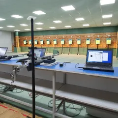 Another look at our range setup, showing the professional grade rifles and electronic scoring systems that our athletes train with every day.
