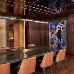 The dining room at the Baid Residence, featuring a Red Dot Award-winning light from Rossana Orlandi and captivating artwork by Shilo Shiv Suleman. The space is designed for an elevated and artistic dining experience.