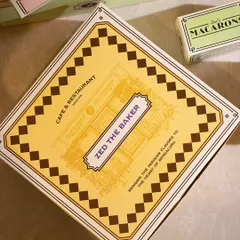 A close-up of the detailed design on my pastry boxes, inspired by the charm of classic French cafés.