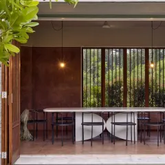 The line between inside and outside is intentionally blurred in our designs. At Villa Uma, we used deep, earthy red plaster walls and large openings to connect the dining space with the surrounding landscape, creating an atmosphere that is both elegant and deeply relaxing.