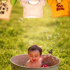 Splish, splash, and a whole lot of laughs. The outdoor tub-time theme is one of my most popular shoots, capturing the pure, uninhibited joy of a baby playing in the water.