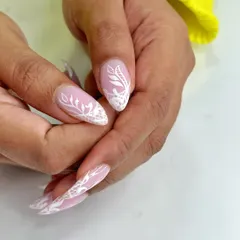 Delicate and beautiful. This design features intricate white lace patterns hand-painted over a soft pink base, perfect for an elegant and romantic look.