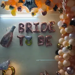 A closer look at the balloon arch and the 'Bride To Be' foil letters, creating a perfect photo booth corner for the party.