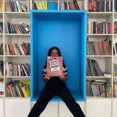 A rectangular blue reading pod built into a library bookshelf. These creative solutions are part of nurturing our client relationships and keeping projects moving forward.