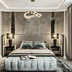 A truly luxurious bedroom with a textured, silver-paneled accent wall and a high-back upholstered bed. The sophisticated lighting and high-end finishes create an opulent and dramatic space.