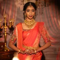 A direct, confident pose showing the full effect of the student's work. The makeup enhances the model's natural beauty, perfect for her special day.