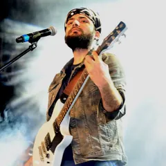 Lost in the music, on stage with my guitar. This is my happy place, where every note tells a story. This shot captures the soul of our Sufi rock and unplugged sets.