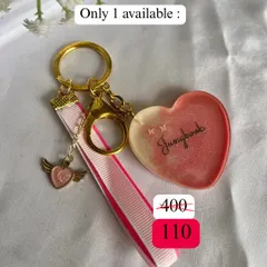 A sweet, pink-themed keychain for all the Jungkook stans. This one-of-a-kind piece comes with a little wing charm, perfect for our golden maknae.