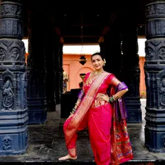 A confident and powerful pose in a traditional Navari saree. This is a look that celebrates strength and heritage.