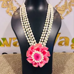 A vibrant pink floral necklace, perfect as a statement piece for a Mehendi or Sangeet function.