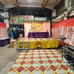 A stage setup for a Labour Day event. The simple backdrop with a banner, a head table, and a podium is perfect for formal presentations and speeches.