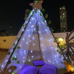 As part of the lavender birthday theme, we added this enchanting teepee tent. Adorned with fairy lights, ivy vines, and a butterfly motif, it served as a cozy and magical photo corner for the teens.