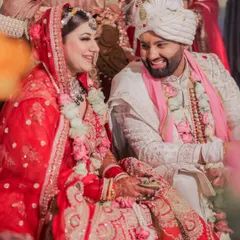 A candid shot of the couple sharing a laugh during their wedding ceremony. This image perfectly captures the genuine joy and lightheartedness of their relationship on their big day.