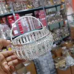 Here I am holding the German silver flower basket in my workshop. It is lightweight yet sturdy, and the design is perfect for carrying flowers for pooja.